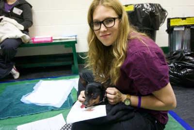 Anna comforts a patient who had to have some teeth pulled in addition to being fixed. Big day for such a little one.